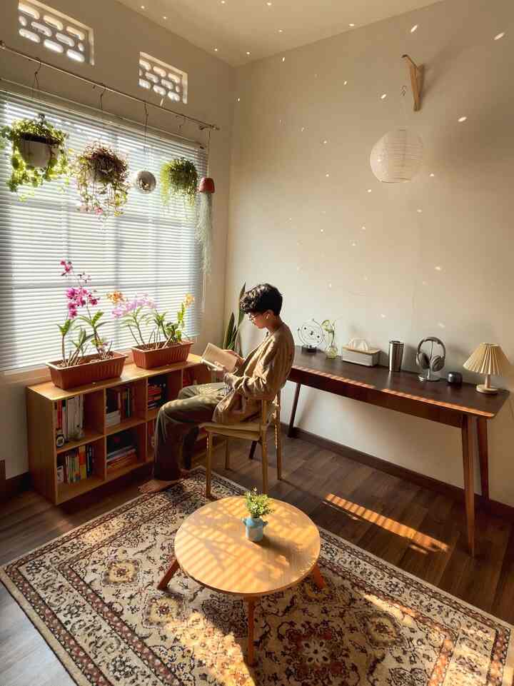 Warm beige and wood tone bedroom featuring plants and bookshelf, creating a cozy and inviting atmosphere