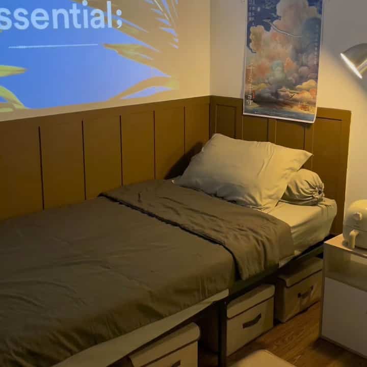 Brown-toned bedroom featuring a centrally placed bed and nightstand with a cozy Mid-Century Modern atmosphere