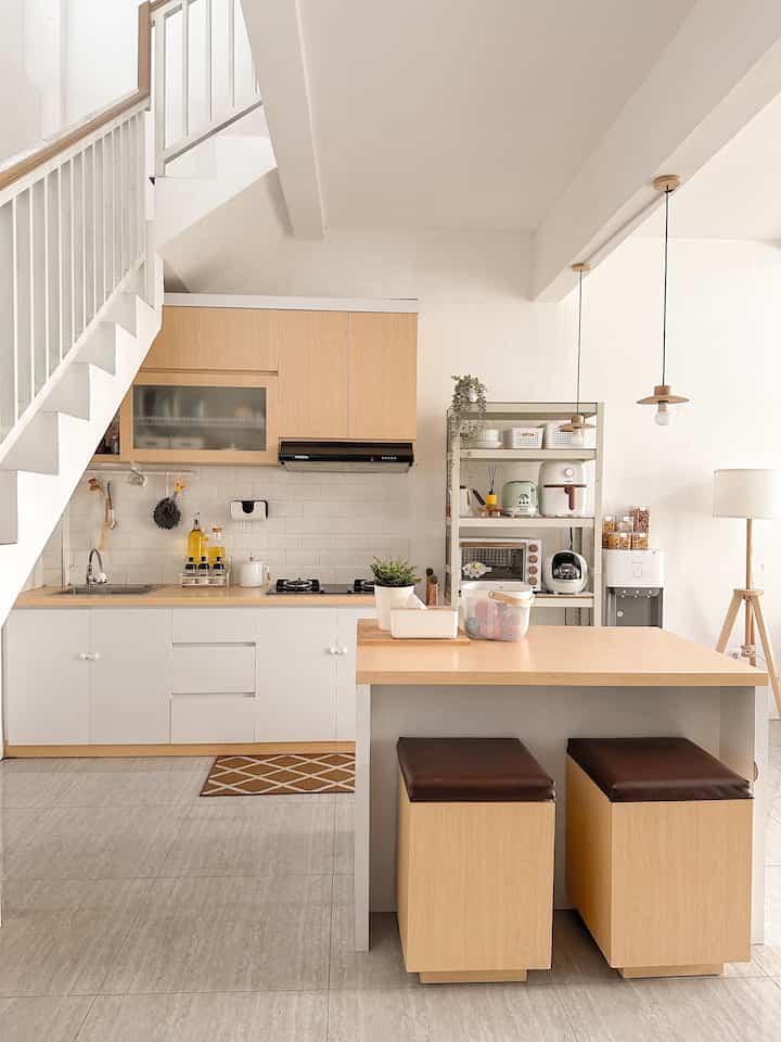 Natural wood tone and white 6-tatami kitchen featuring a kitchen island and organized storage shelves with clean interior