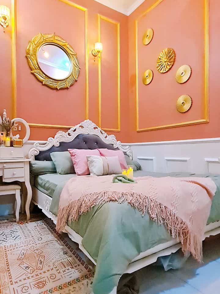 Pink and gold toned 4.5-tatami bedroom with classic white carved bed and nightstand, elegant wall mouldings and decor creating cozy interior