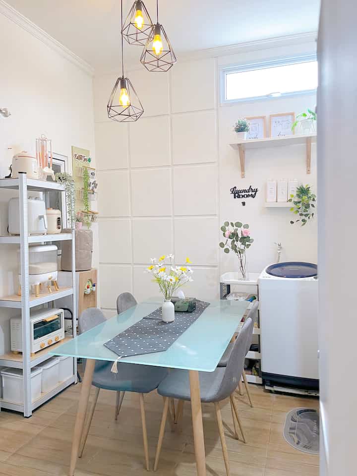 White background and light brown floor small laundry room featuring pendant lights and a glass table with a clean atmosphere