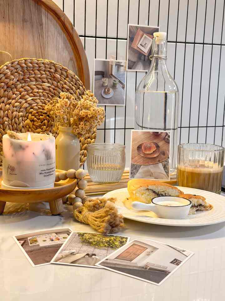 Natural tones and transparent materials in kitchen dining table scene featuring morning breakfast set and cozy decor items