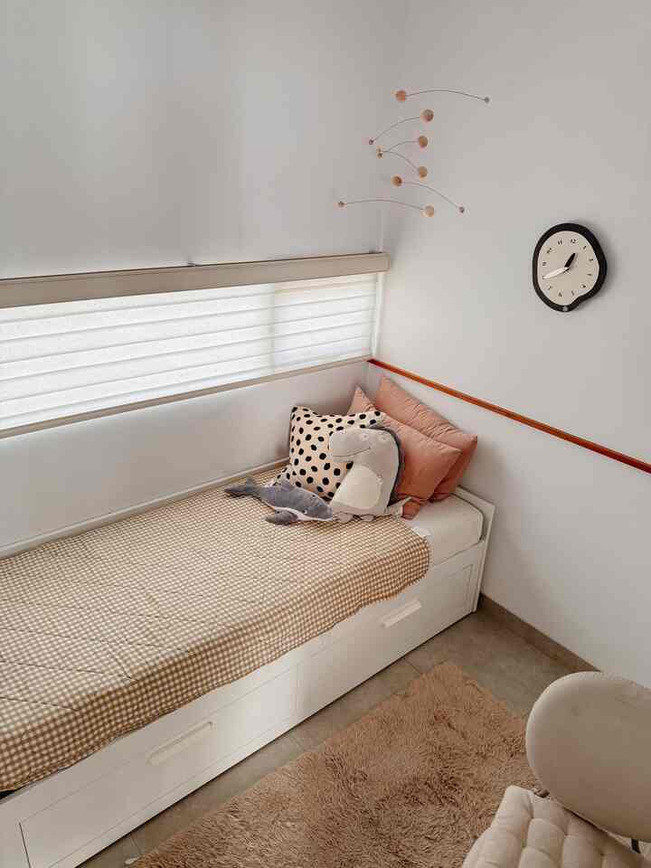 This guest room is often used as a work space, because its function is still changing, we decided to fill it with multifunctional furniture (a cot that can be pulled out to a size of 160cm and a work desk that can be used as a dressing table).
The color tone in this room is dominated by white to make it more neutral because its function still changes according to needs, in contrast to other rooms which use natural wood colors.

#BedroomStyling #BedroomDesign #BedroomInspo #KamarTidur #RumahMungil #RumahCluster #ScandinavianHouse 