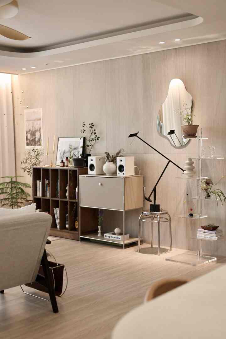 A bright wood tone living room with various objets and a mobile, showcasing a modern atmosphere