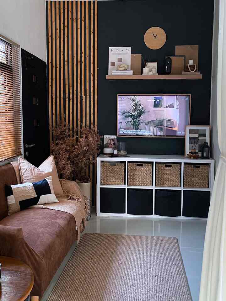 Brown and white toned living room featuring sofa and TV stand storage cabinet in a neat, minimalist space