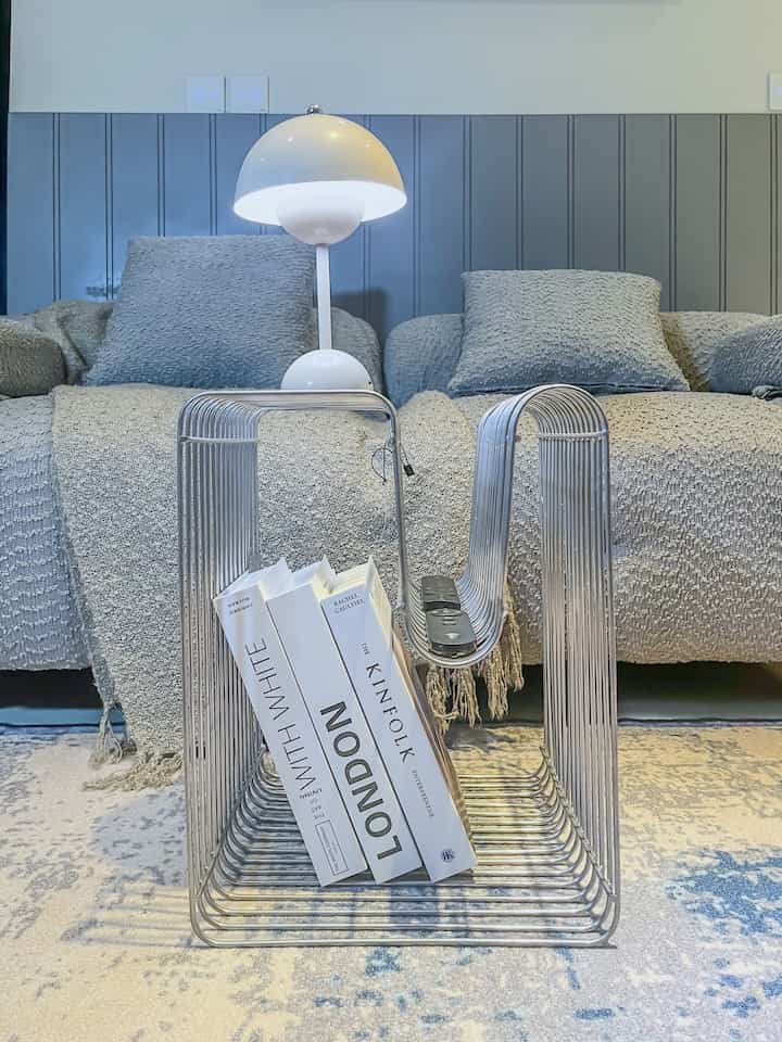 Since moving into this house, I really wanted to create a comfortable yet aesthetic atmosphere. Finally, I started looking for little things to fill the corners of the house to make it more lively and personal. 

For example, I gave this bar dining table a simple touch using a table runner sheet (129k), dried plants (20k), portable power outlets (100k), roller blinds (638k), and my favorite, a coffee maker (527k). The total is only 1,414k! 

Then on the coffee table, I really fell in love with the wire side table (1,500k), plus a cute mushroom lamp (200k), 3 dummy books (60k), and a cozy blanket (160k). The total is only 1,920k! 

Oh yeah, I didn't want to miss out on the dry garden either! I used 3 terracotta pots (100k), 3 plants (30k), a plant stand (250k), and white pebbles (50k). The total is only 430k! 

How about you neighbors, is it affordable to make your room more aesthetic?

#RenovationMaterial
#CheapMaterial
#HomeDecor #AffordableStyle #InteriorDesign #RuangEstetik #TipsDekorasi #InformaHome #CoffeeMaker #WireSideTable #LampuJamur #PotTerakota #RollerBlind