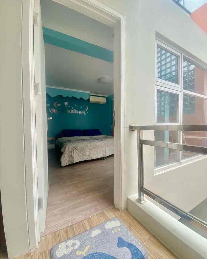 White and blue toned 6-tatami bedroom featuring a large bed centrally placed with cozy atmosphere