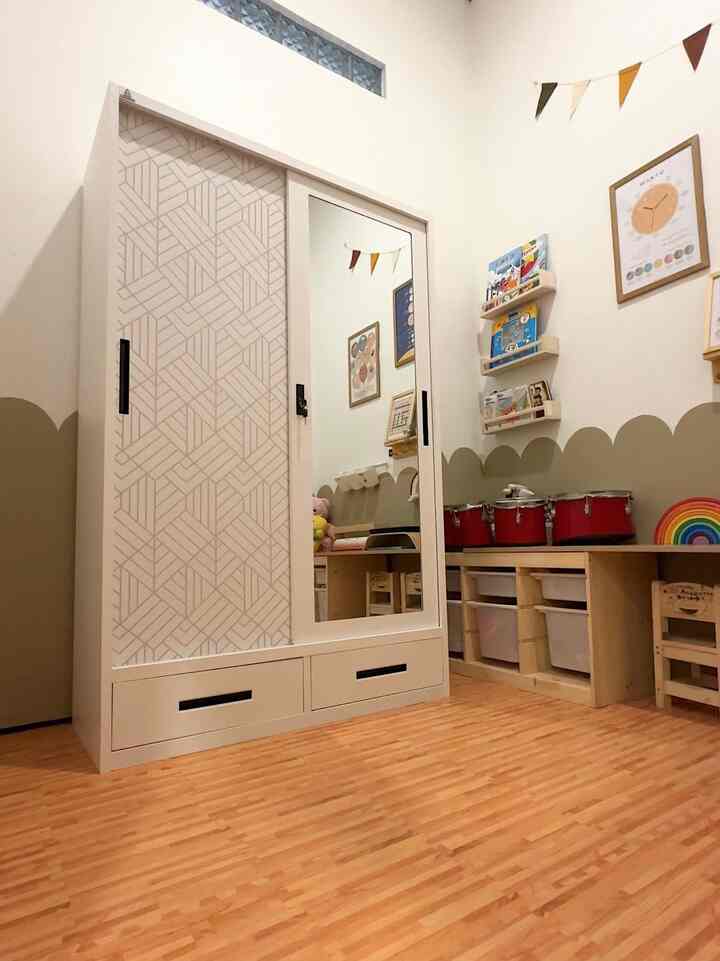 Natural color and wood tone kids' room featuring children's desks and toys in a cozy setting
