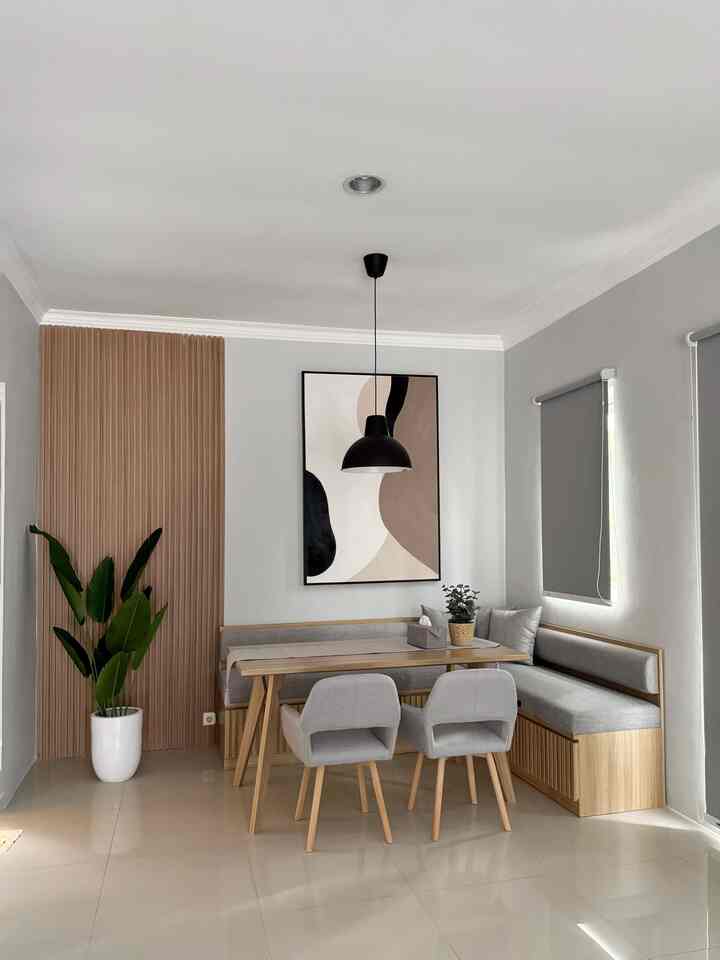 Simple dining room for 4 people with gray and wood tones, featuring an L-shaped bench and a pendant light