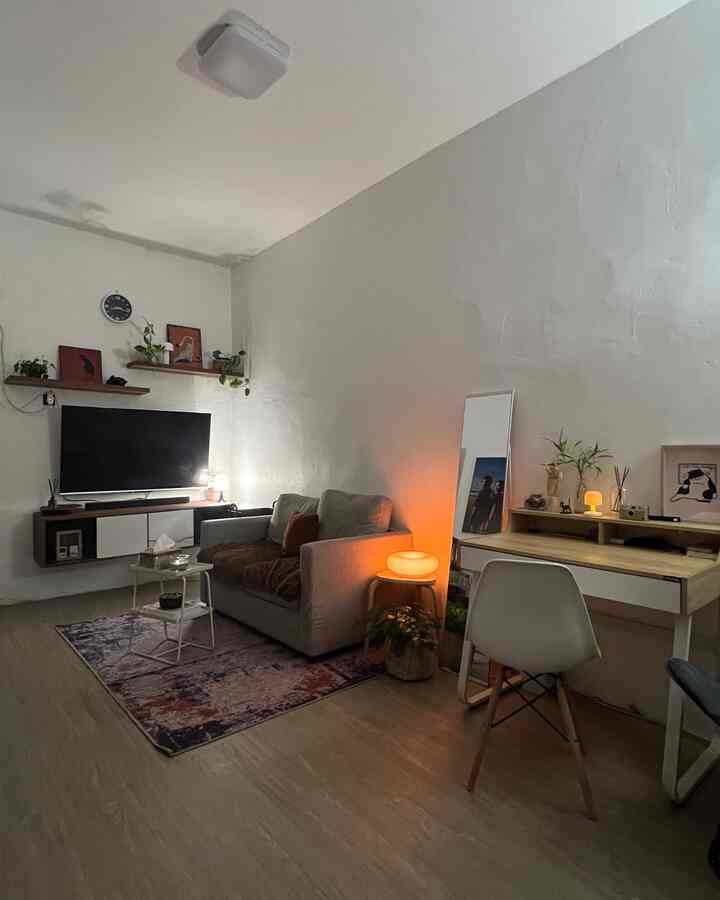 White and wood tone living room and workspace with a natural, compact open-space design