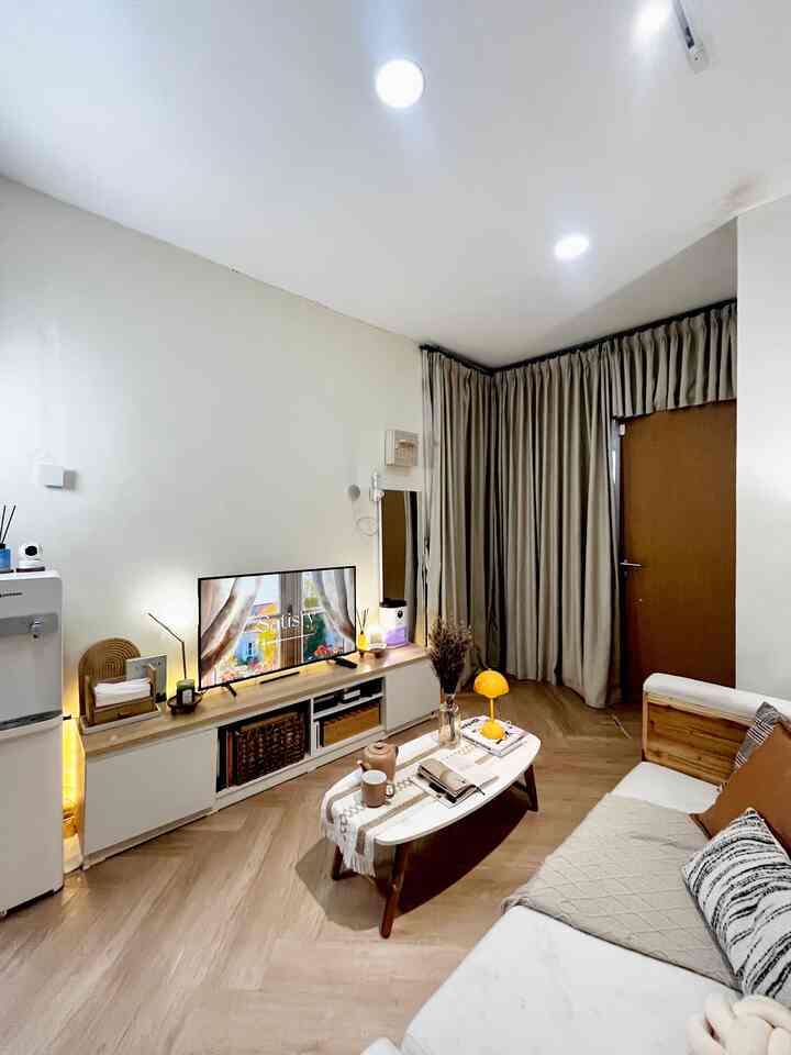 White and brown toned living room featuring sofa and coffee table with a cozy atmosphere
