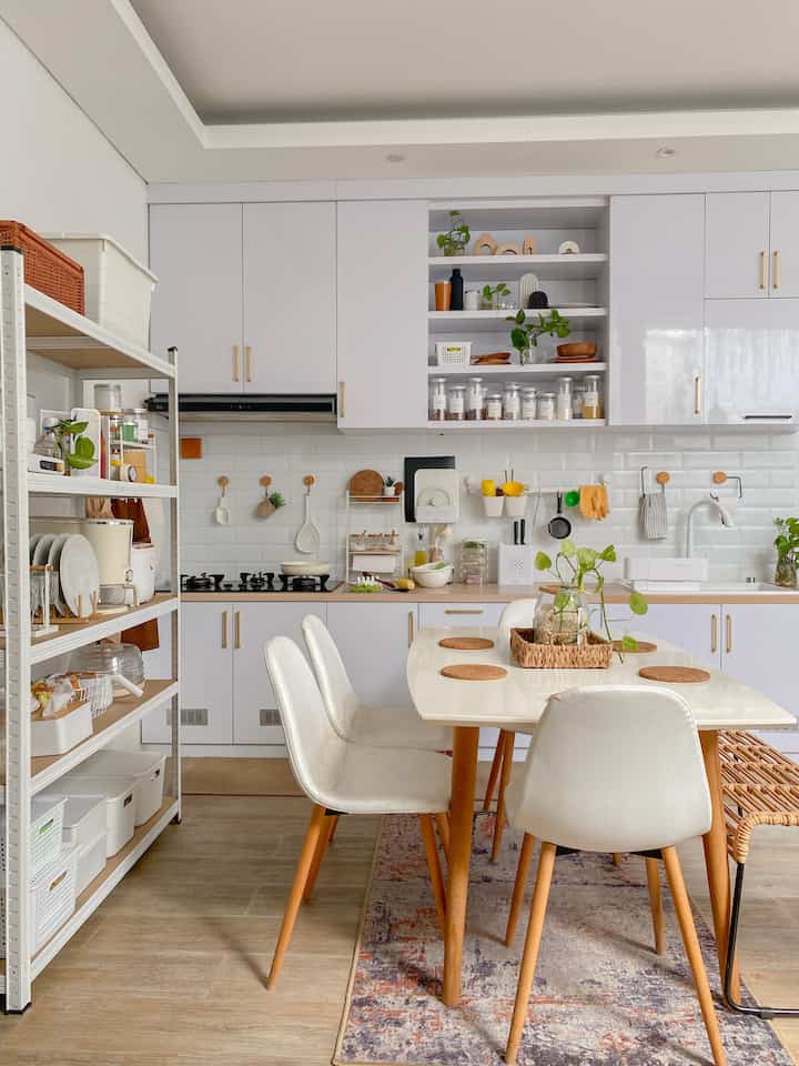 Perubahan Kecil, Dampak Besar ✨

Kadang, gak perlu renovasi besar-besaran untuk menciptakan suasana baru di rumah. Aku coba beberapa perubahan kecil di dapur, dan ternyata hasilnya lebih dari ekspektasi!

✨ Ganti Handle Kitchen Set
Sentuhan kecil yang bikin kitchen set lama terlihat lebih segar dan modern. Pilih desain yang senada dengan konsep dapur, dan voila! Aku disini ganti dari warna hitam jadi gold, love it! 👌🏻

✨ Menambah Ventilasi di Kitchen Kabinet
Ini bisa menjadi pembelajaran, jangan sampai terlupakan seperti aku. Untuk menjaga sirkulasi udara, akhirnya aku tambahkan ventilasi di area tertentu, yaitu di bawah sink dan di kabinet bawah kompor tempat penyimpanan gas. Ini membantu mengurangi kelembapan di bawah sink dan memastikan aliran udara lebih baik di area penyimpanan gas, sehingga lebih aman dan fungsional.

✨ Tambah Karpet dan Runner Rugs
Karpet di bawah meja makan dan runner rugs di sepanjang kitchen set ternyata bikin perubahan besar juga. Selain menambah estetika, karpet di area makan bikin suasana lebih hangat dan nyaman. Sementara itu, runner rugs membuat area dapur lebih aman dan tidak licin, sekaligus memberi sentuhan dekoratif yang menyatu dengan keseluruhan konsep dapur. Efeknya? Superb! 👌🏻

✨ Ganti Sink
Upgrade area cuci piring dengan sink baru yang lebih nyaman dan estetik. Aku pilih sink baru berbahan Quadra Stone warna putih karena tahan gores, anti noda, dan tampilannya elegan. Sebelumnya, sink terlalu kecil dan kurang dalam, jadi kurang nyaman dipakai. Dengan ukuran yang lebih besar dan dalam, aktivitas cuci piring jadi lebih praktis, sekaligus bikin dapur terlihat lebih stylish.

✨ Tambah Lemari untuk Pantry
Solusi simpel untuk penyimpanan ekstra. Kamu bisa pilih lemari terbuka atau tertutup, sesuai kebutuhan. Kalau aku sendiri pilih yang terbuka, supaya lebih mudah diakses. Meskipun ada risiko debu, aku rasa ini masih lebih praktis karena semua bahan masak, peralatan dan perlengkapan dapur langsung terlihat dan siap dipakai. Akhirnya, dapur jadi lebih rapi dan terorganisir!

Semoga menginspirasi ✨

#KitchenSet
#KitchenSetMinimalis
#MejaMakan
#KeramikBacksplash
#LemariSusun
#Karpet
#RunnerRugs 
#KesetDapur
#HandleLemari
#MyDreamKitchen
#KitchenRenovation
#KitchenStyling