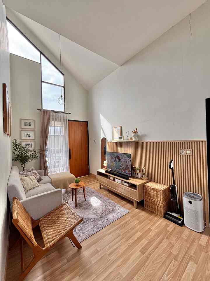 Cozy living room with warm wood tones and white walls designed for families with kids, featuring safe furniture and an anti-slip carpet
