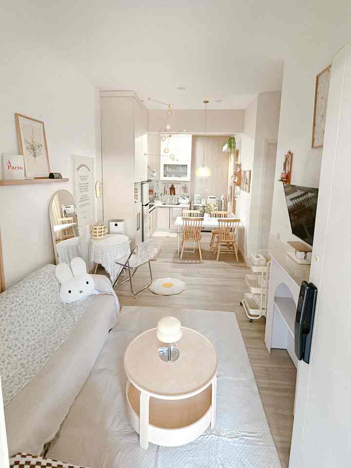 White and beige toned living room and kitchen featuring natural modern style for a 4-person household