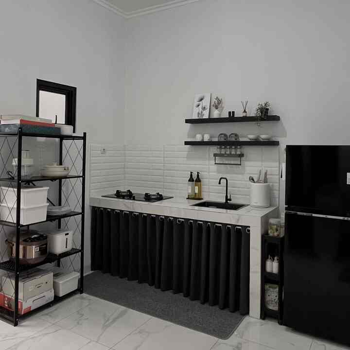 Small kitchen in white and black tones, featuring neat storage and minimal design