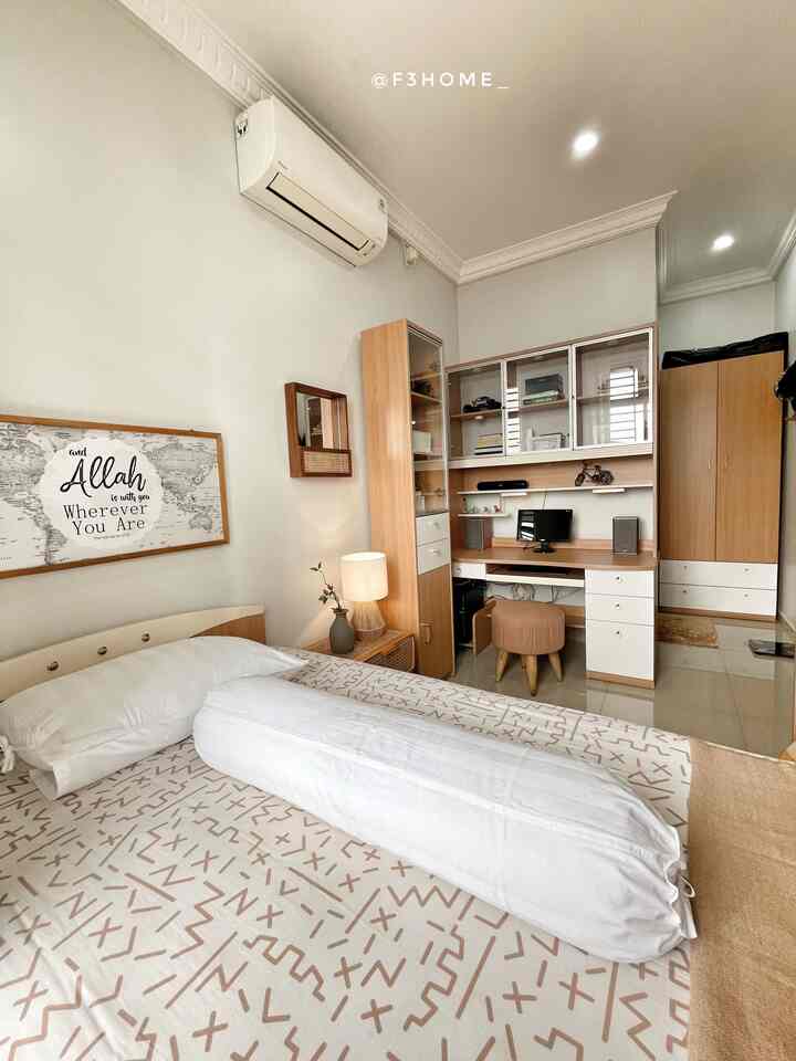 White and natural color bedroom featuring a bed, desk with computer, and wardrobe for a clean and functional space