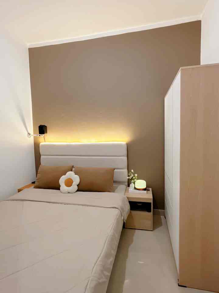 Beige and brown toned bedroom featuring LED headboard lighting and wooden furniture creating cozy atmosphere