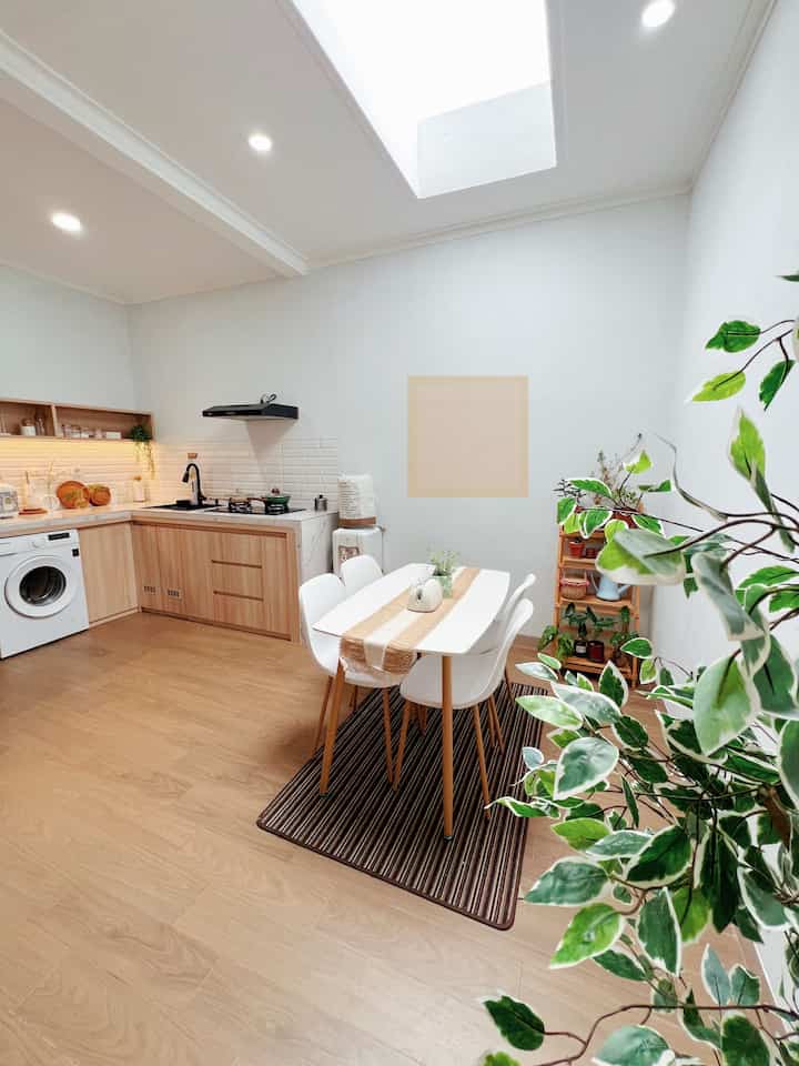 Open space is still my favorite concept because a 60m2 house looks more spacious 🥰
For a fresher look, I added some indoor plants and artificial plants too. 
Oh yeah, because this house is tiny, I made the kitchen integrated with the laundry area.. 

What do my online neighbors think about my tiny house? 🥰🫶🏻

#hpltaco #mesincucifrontload #tempattissue #tablerunner #mejamakanikea #penyedotasaprinnai #tudungsajitingkat #raktanamankayu #kitchenanddining #renovasikitchen #kitchenmakeover #ruanganopenspace #inspirasikitchen #inspirasidapurmungil #dapurcompact #compactkitchen