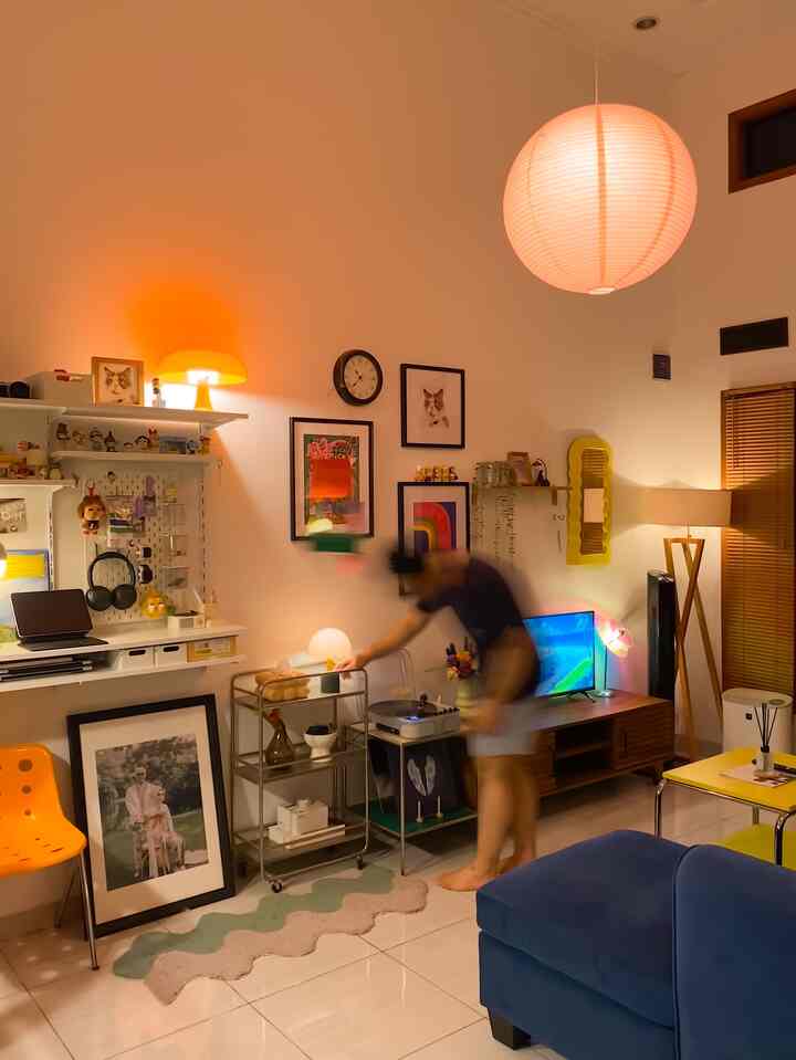 Warm vivid-toned living room featuring vintage furniture and decorative items, creating a cozy atmosphere