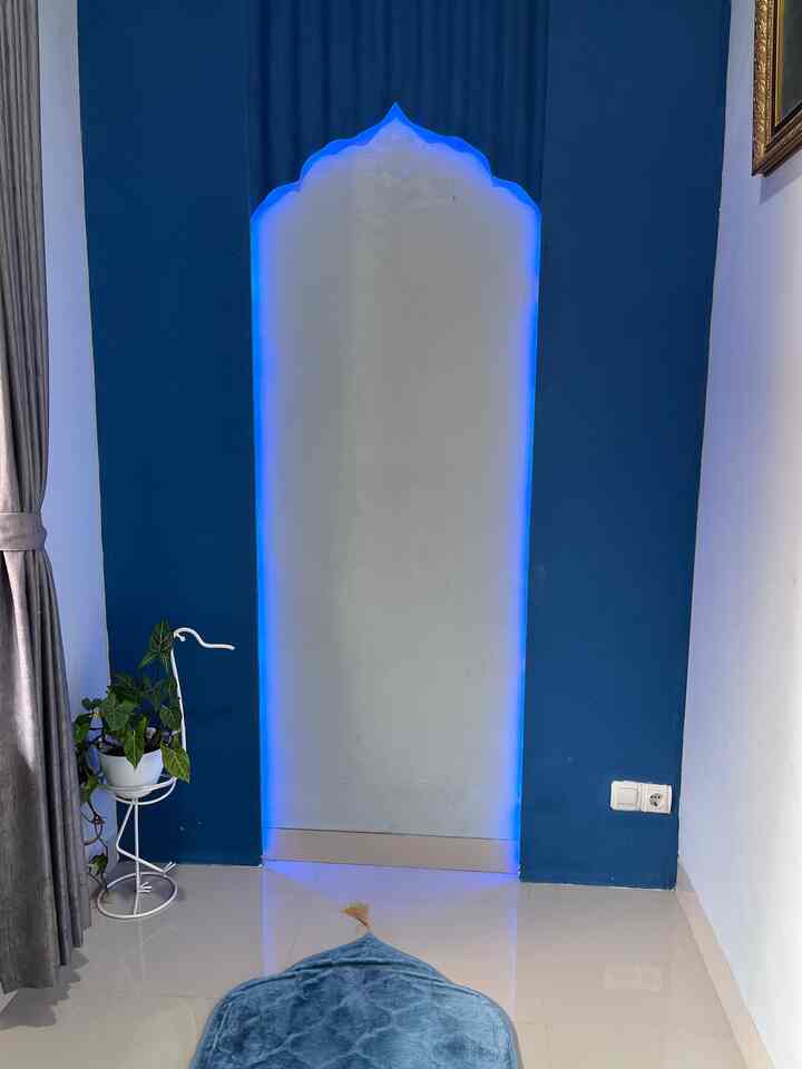 Blue and white tone small room featuring an arched niche with blue LED lighting and minimalist decor