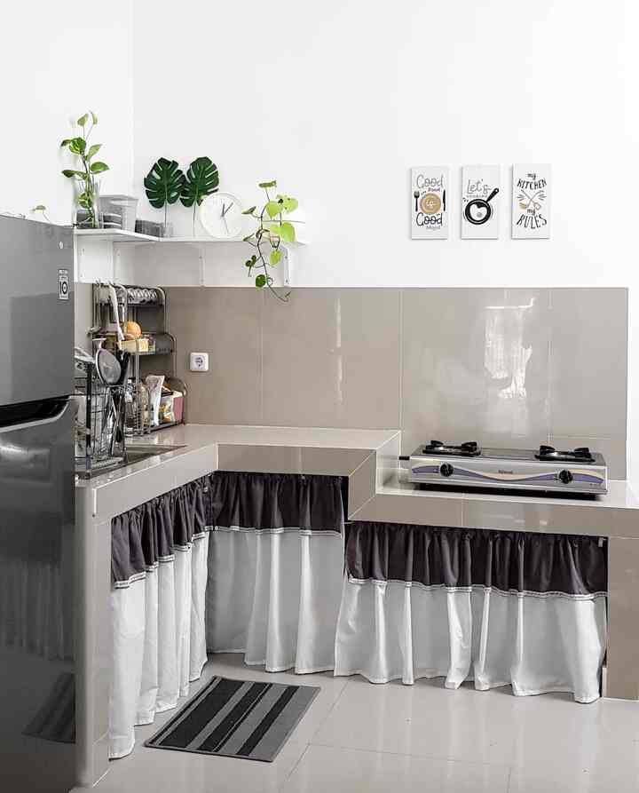 White and gray toned kitchen featuring granite countertops and practical storage with lower curtain coverings