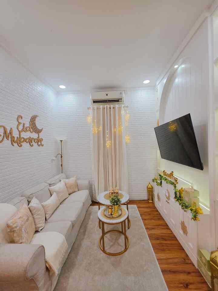 White and brown toned small living room featuring sofa and coffee tables with natural modern style