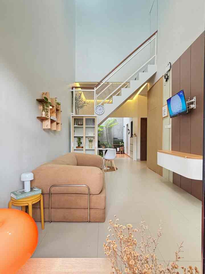 My living room or family room is an open space that extends to the garden, 
Because this living room is long, I made a TV backdrop to make it more aesthetic. 
I also chose simple and multifunctional furniture to keep it looking spacious, a sofa that can be used as a bed and a TV cabinet with a hanging model because it is simpler and still looks spacious. 

#Livingroom #BackdropTV #RumahOpenSpace #RumahLega #RumahTanpasekat #SofaGraphite #SofaBed #LampuAesthetic #HighCeiling