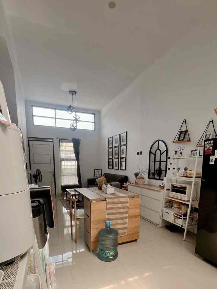 White walls and wood tone furniture in a natural modern dining room for a two-person household