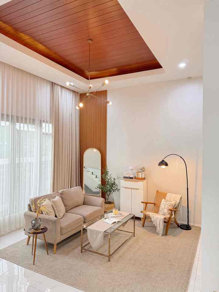 The living room is not just a place to sit, but also a place where the story begins.

How do I style my living room? I need to choose decorations that I think are in accordance with the modern Japandi concept, such as wooden furniture choices and some are gold like lamps and tables.

One room, a thousand styles, a few tips from me, even though the living room area is not too large, you can still do Relayout so you don't get bored.. Styling the living room also reflects character.
Choose furniture with neutral & matching colors or adjust it to your home concept 👌🏻

#minimalistsofa #plavonpvc #stylingruangtamu #dekorasilivingroom #inspirasilivingroom #cozyplace #homestory

