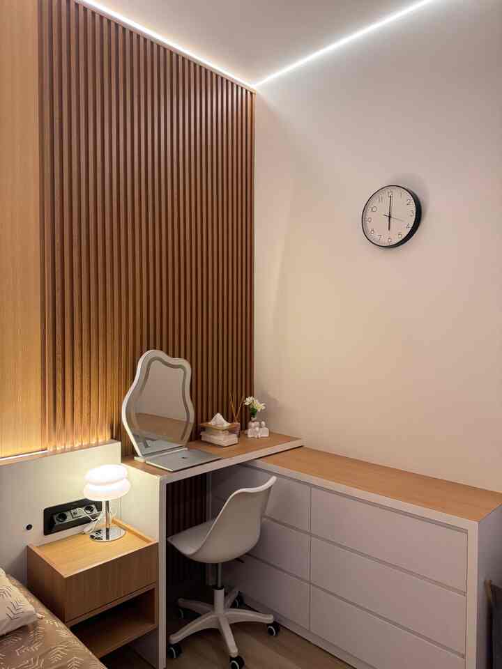 Cozy bedroom home office with wood tone and white, featuring minimal desk and chair setup