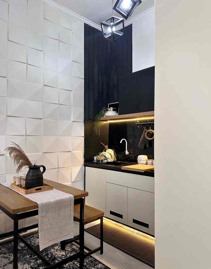 Modern compact kitchen and dining area featuring white, black, and wood tones with clean lines