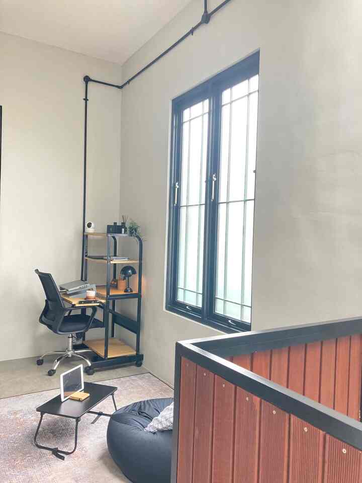 Light gray walls and black furniture in a compact home office space