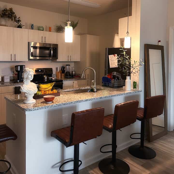 #kitchen #dining #contemporary #granitecountertop #kitchenisland **The kitchen part of my open floor plan apartment** You might not be able to tell by this picture, but six people can comfortably eat around this kitchen island. I have two other bar stools that are not in this shot. I keep them along a wall that you dont see in this picture. There is no need to have a proper kitchen/dining table in this apartment.
