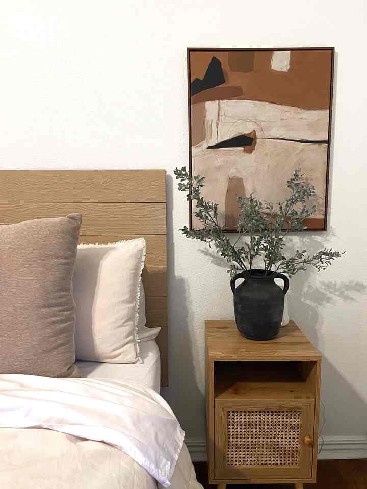 I love bringing warm tones into our primary bedroom. This vase & stems are so versatile too! #primarybedroom