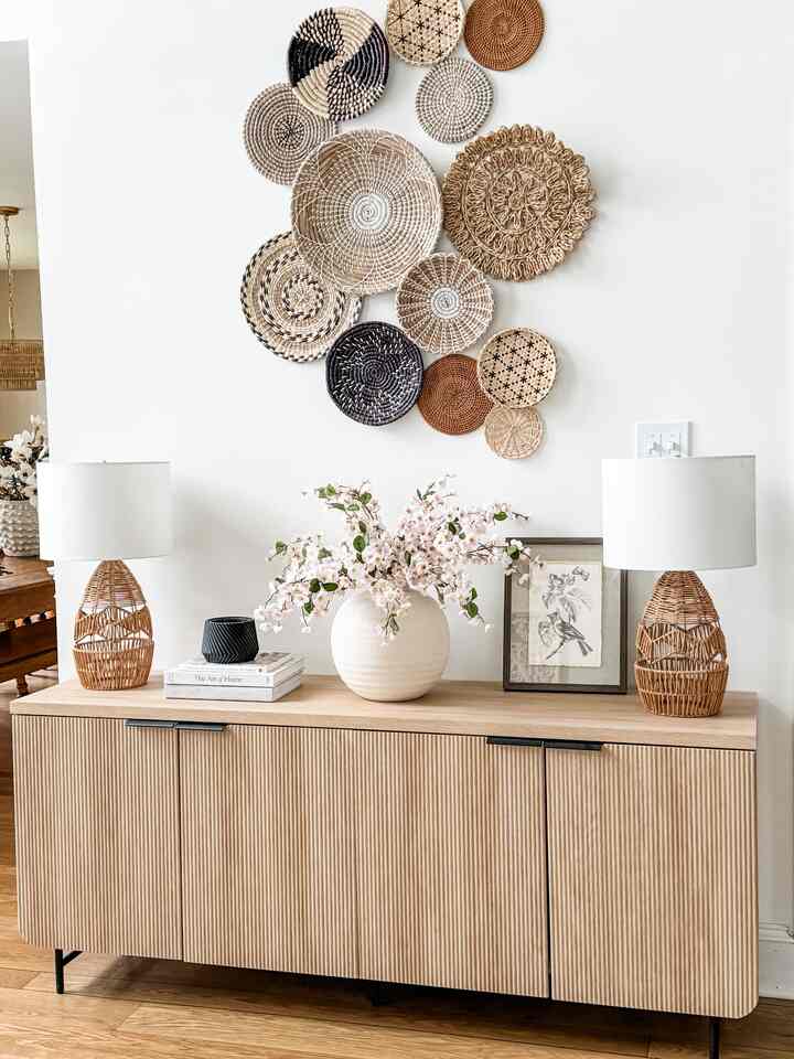 Natural color tone living room featuring rattan lamps and handcrafted Bohemian wall decor creating a cozy atmosphere