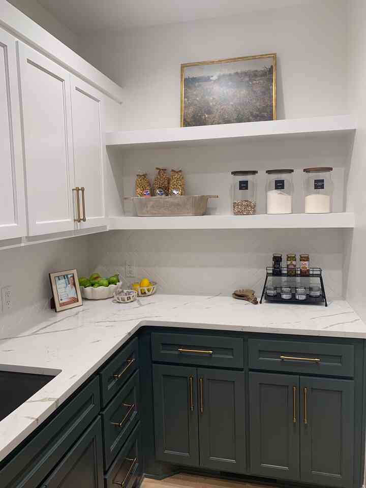 A two-toned pantry featuring white uppers, deep blue lower cabinetry and gorgeous white quartz countertops. 
#pantrydecor #pantryorganization #twotonekitchen #kitchenstorage