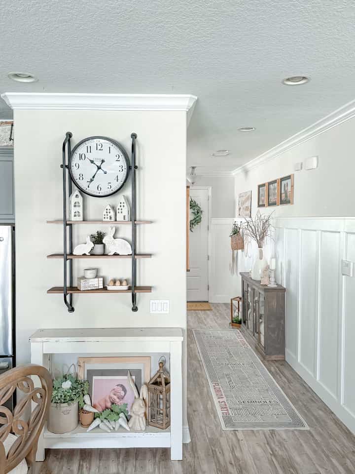 The natural lighting in our entryway makes this space feel so much larger. #woodenfurniture #wallshelf #rugcarpet 