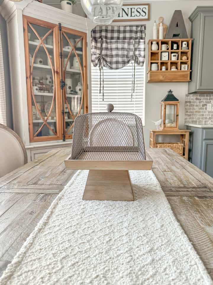Wooden tones are always my go to decor items. I love our dining room. #hutch #buffalocheck #cozyhome 