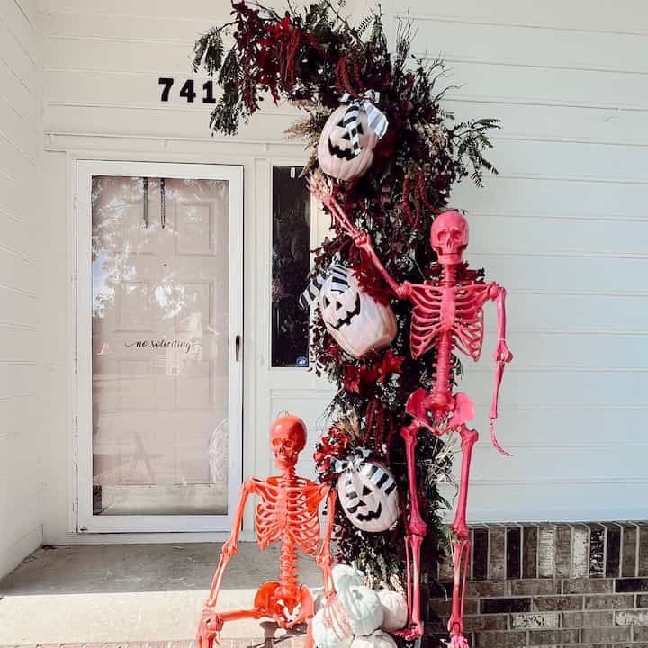 Halloween Front door decor #halloween #spookydecor #floralarch #halloweenprops 