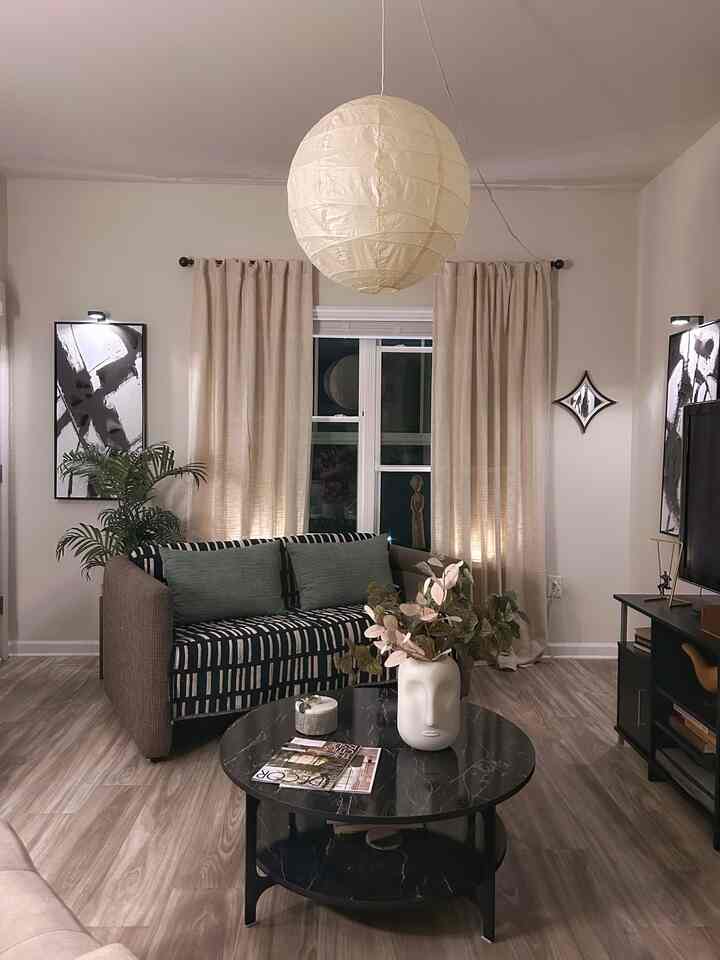 I now have a round cocktail table. And my old couch has a new look. #cocktailtable #table #couch #loveseat #pendantlight ￼