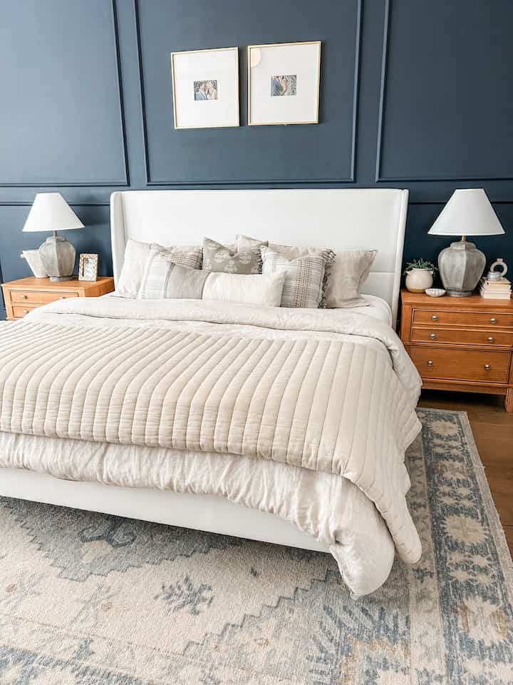 Primary bedroom styling - white upholstered bed with neutral bedding. Walls are Hale Navy 

#primarybedroom #upholsteredbed 