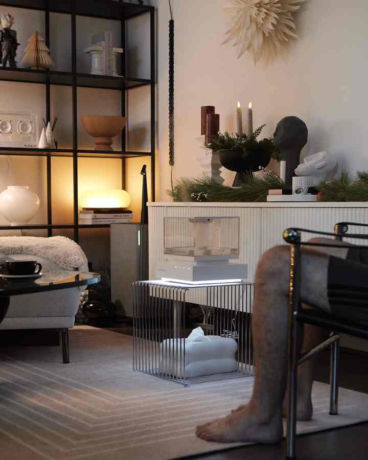A living room interior featuring a humidifier with soft lighting 

#livingroom #livingroominterior #livingroomdecoration #humidifier #tissuecase #tissuecover #rug #ruggable #cabinet #stool #shelf #lighting #lightingconstruction 