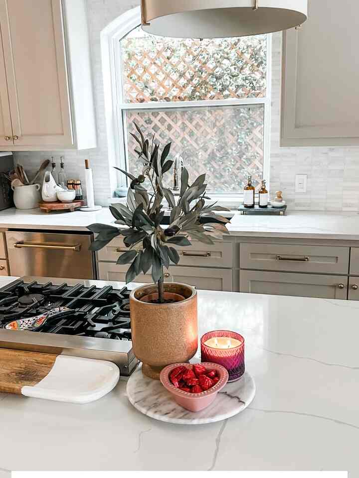 An easy little Valentine centerpiece for our kitchen island! #ValentineDecor #Valentine’sKitchen #ValentineCandle ￼
