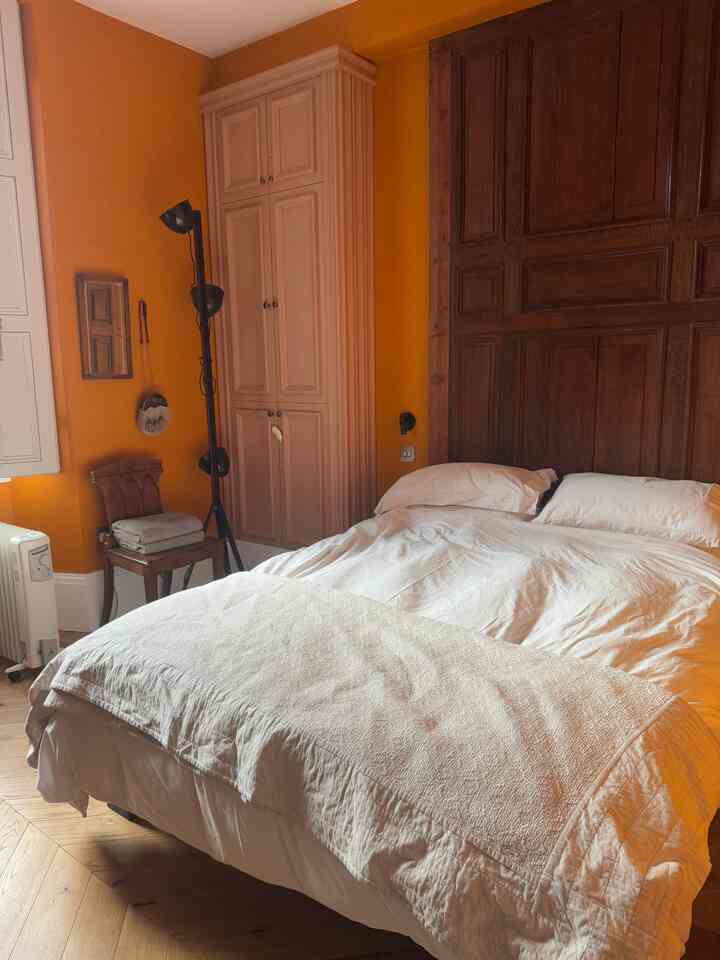 Warm and cozy art deco bedroom - love the custom wall panels!! #artdeco #bedroom