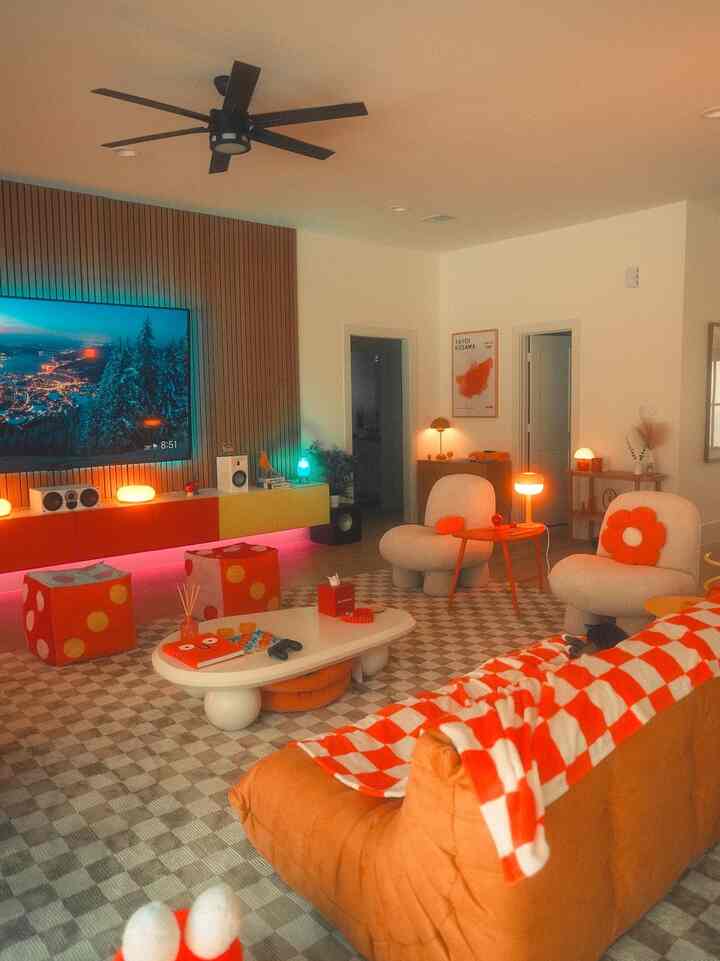 Living room in red and white tones featuring cozy sofa and uniquely designed furniture, creating a warm and vibrant atmosphere