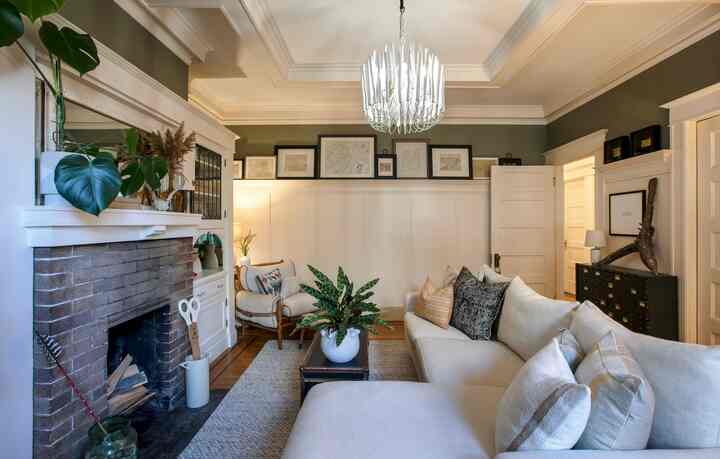 One of a kind collected items sprinkled throught with the original details of the home make this space truly shine! #livingroominterior #livingroom #livingroomdecoration #livingroomwithouttv #livingroomplant #livingroomlighting #eclectic