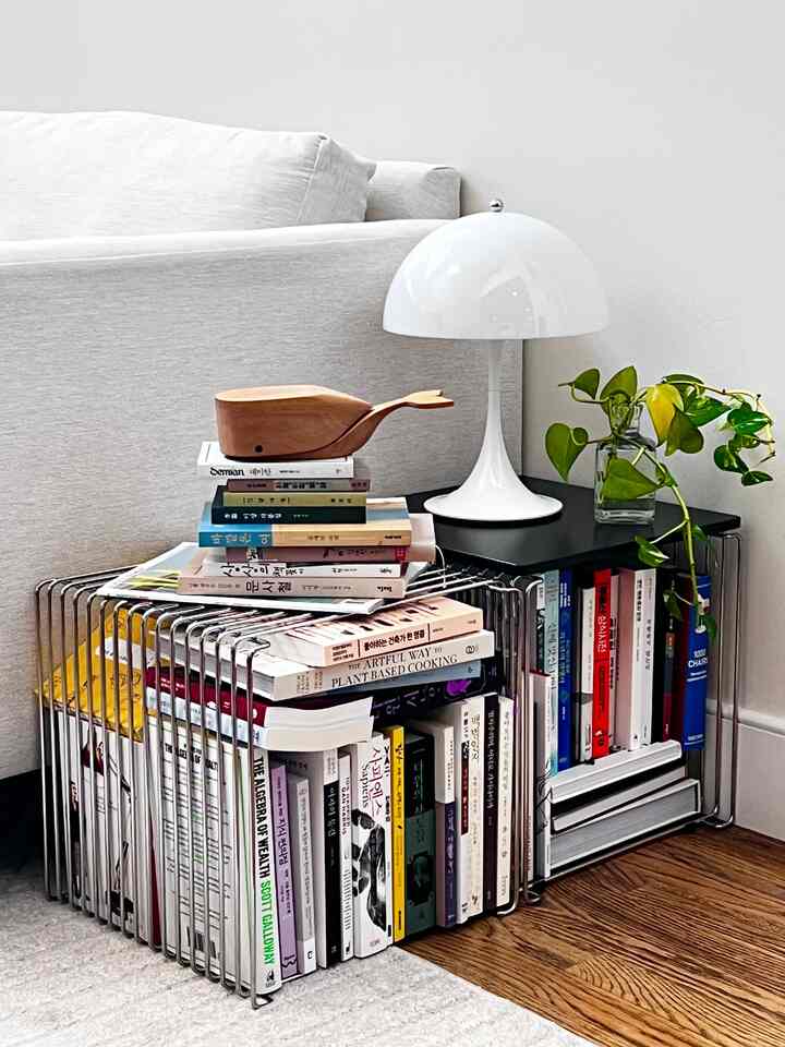 Some of my recent reads stacked below a whale. #readingnook #livingroomcorner #livingroomdecor #loftstyle #warminterior #livingroom #livingroominterior #livingroomdecoration