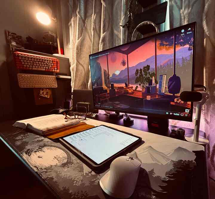 Warm brown and white toned home office featuring a large monitor and a compact desk setup for a comfortable workspace