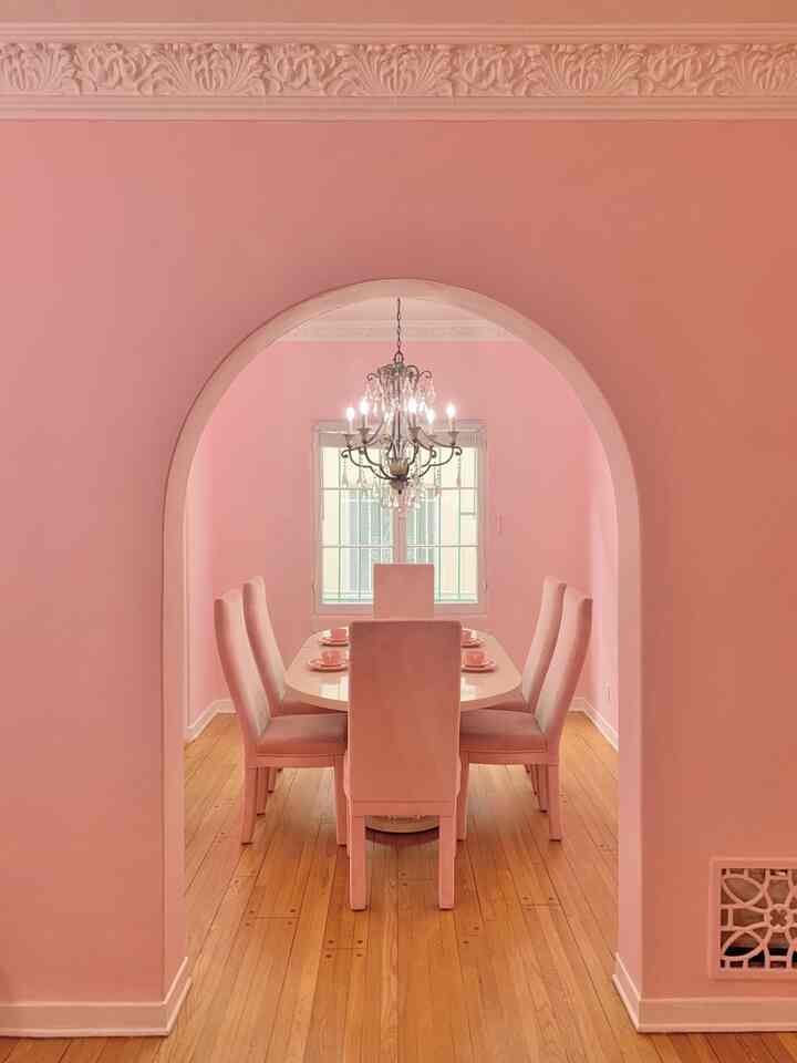 I’ll always love how perfectly this archway from my old vintage apartment framed this dining room 💗 #pink #vintage #diningroom #pinkchair #chandelier ￼