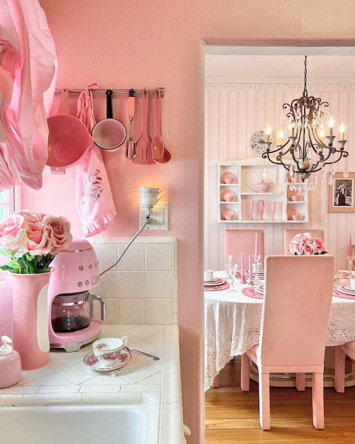 I love the view of the pink polkadotted kitchen, looking into the pink striped dining room. I wanted it to feel very Alison Wonderland & shabby chic inspired 🌸🎀 #pink #kitchen #diningchair #shabbychic #teacup 